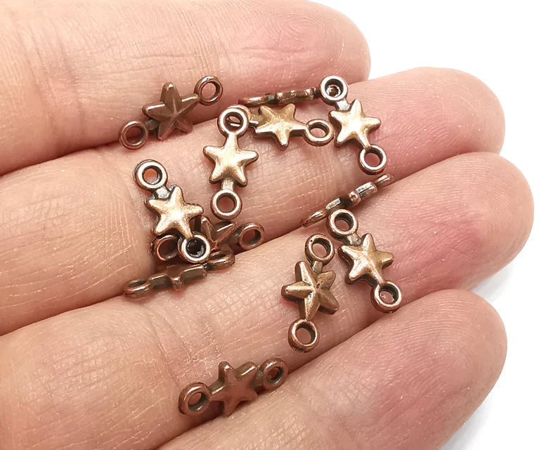 10 Star charms are made of nickel free and lead free antique copper plated zinc alloy metal. Size : 14x7 mm.
