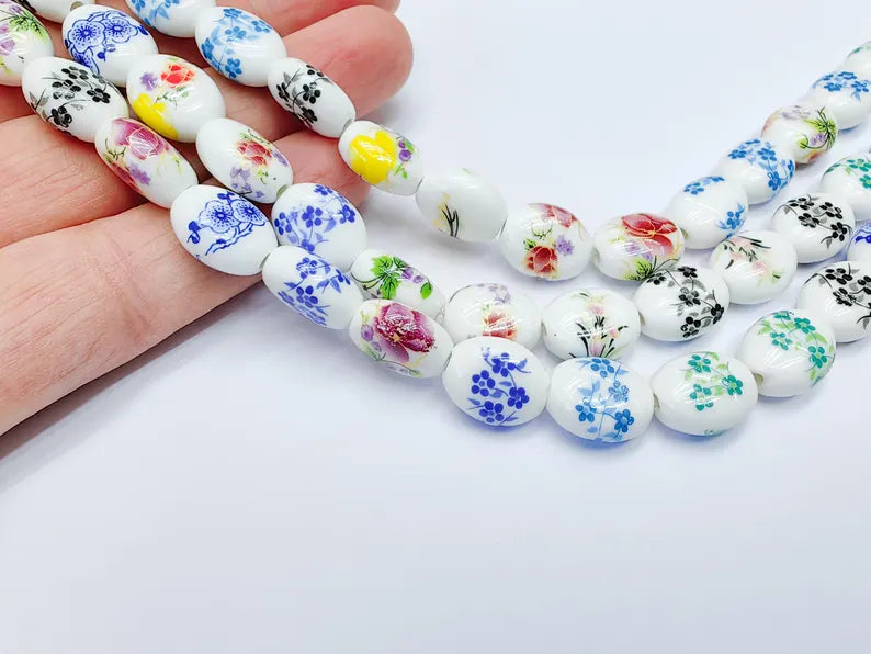 22 Floral Oval Porcelain Ceramic Bead Strand, 22 Pcs Full Strand, White Beads with Colorful Flower Print, 14x11mm Glossy Jewelry Bead G37021