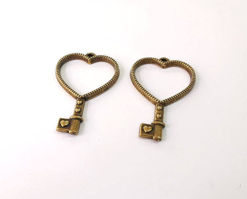 4 Heart key charms Antique bronze plated charms (41x25mm) G24159