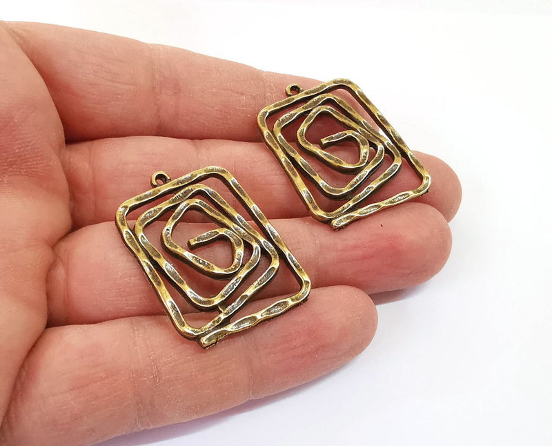2 Spiral charms Antique bronze plated charms (34x26mm) G24181