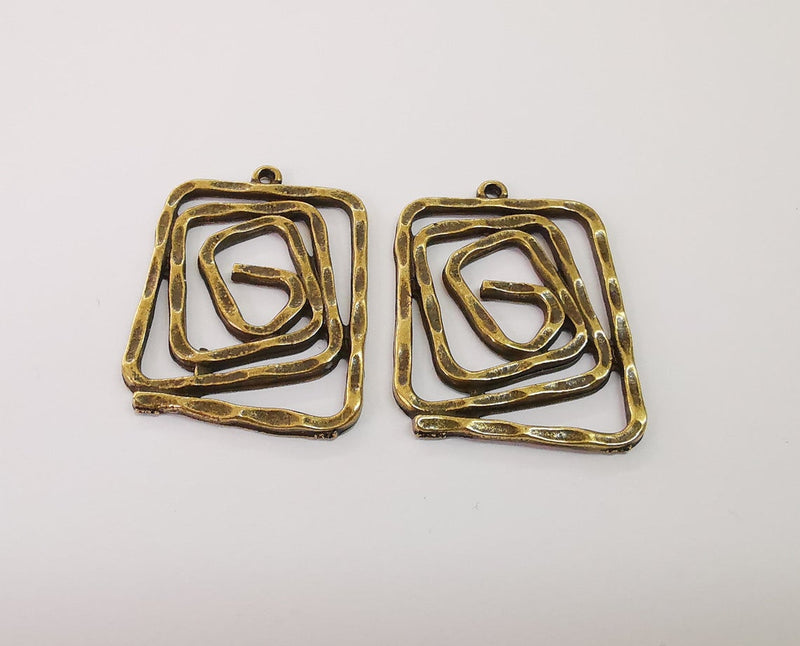 2 Spiral charms Antique bronze plated charms (34x26mm) G24181
