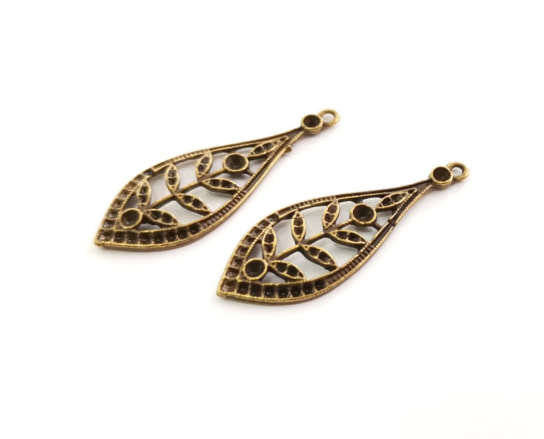 4 Leaf Charms Antique Bronze Plated Charms (44x16mm) G25483