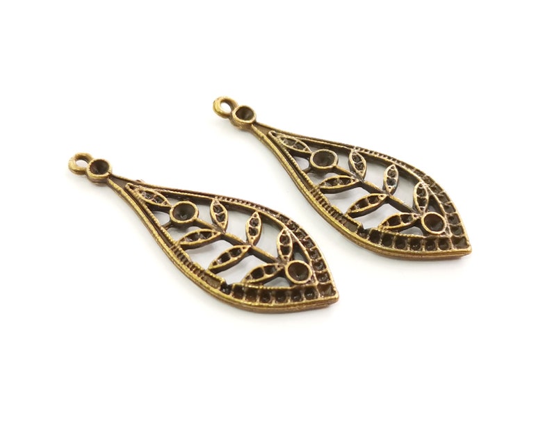 4 Leaf Charms Antique Bronze Plated Charms (44x16mm) G25483