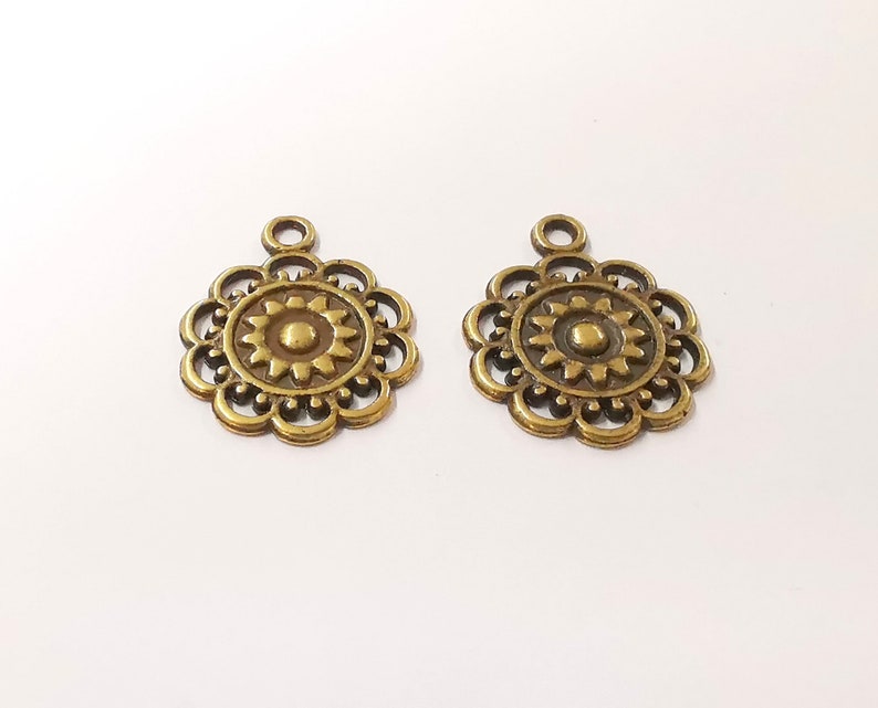 10 Sun charms Antique bronze plated charms (25x20mm) G24867