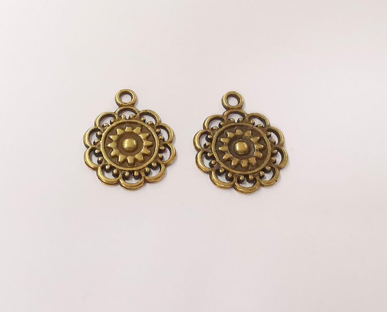 10 Sun charms Antique bronze plated charms (25x20mm) G24867