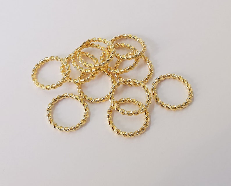 10 Twisted circle findings Shiny gold circle findings (15 mm) G24562