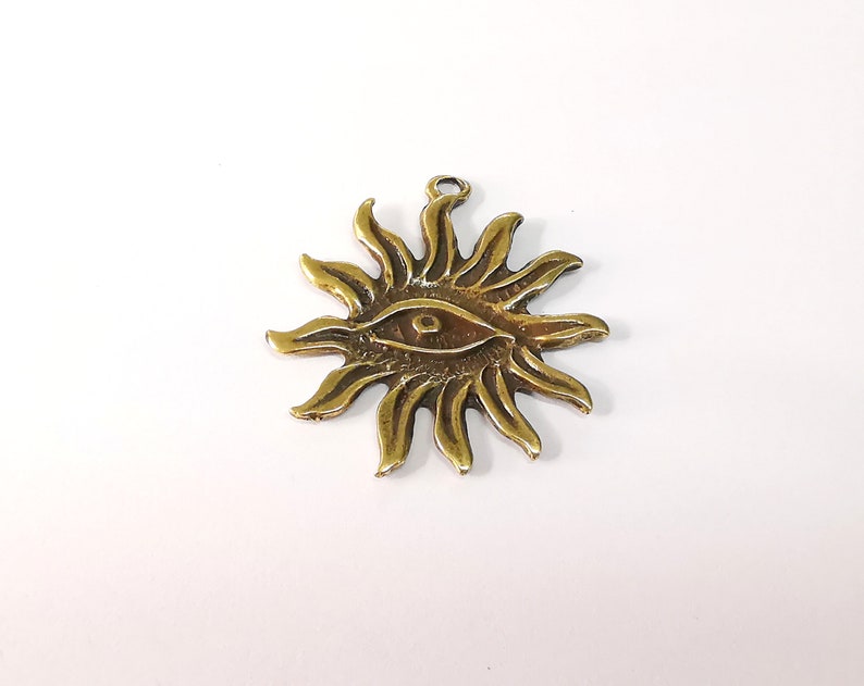 Sun Eye Charms Antique Bronze Plated Charms (49x42mm) G24705
