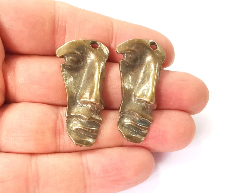 2 Face charms Antique bronze plated charms (40x20mm) G24555