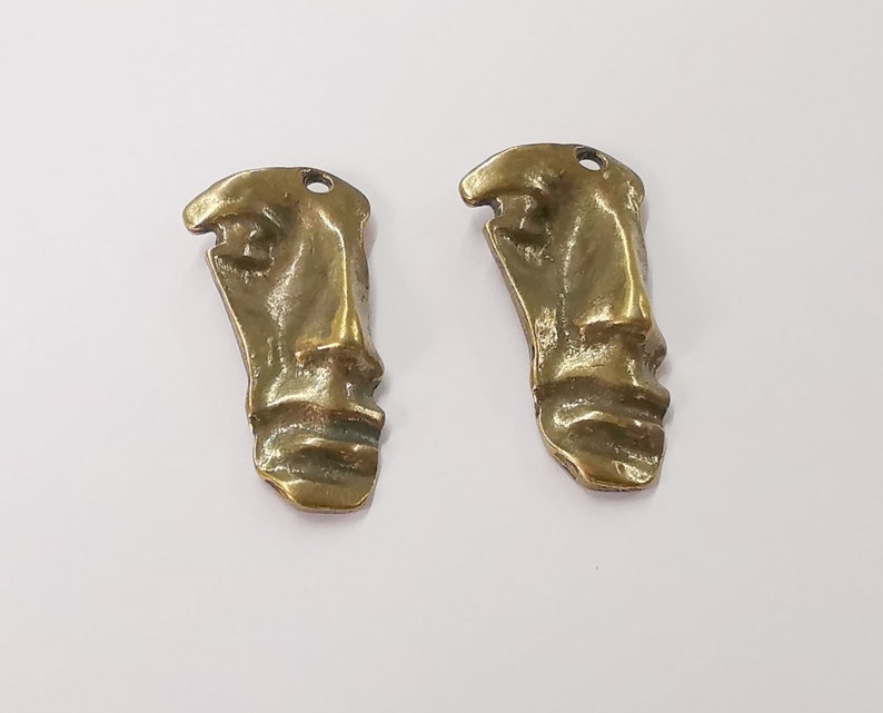 2 Face charms Antique bronze plated charms (40x20mm) G24555