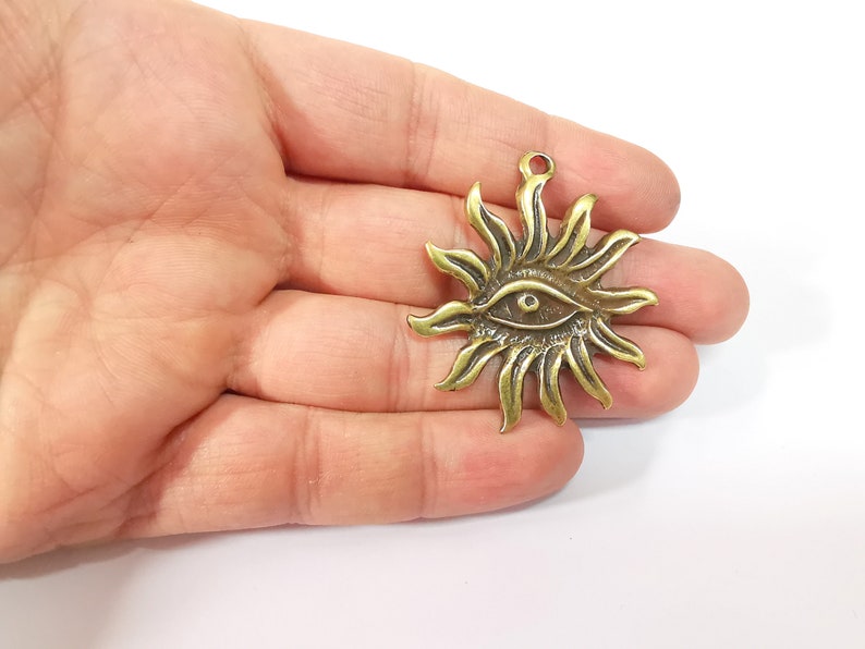 Sun Eye Charms Antique Bronze Plated Charms (49x42mm) G24705