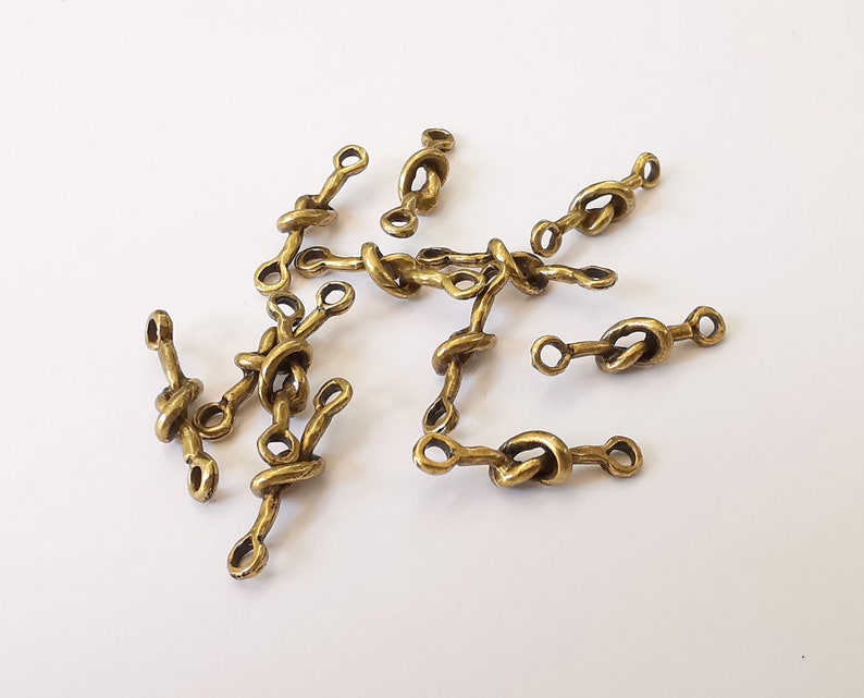 10 Knot connector charms Antique bronze plated charms (21x5mm) G25128