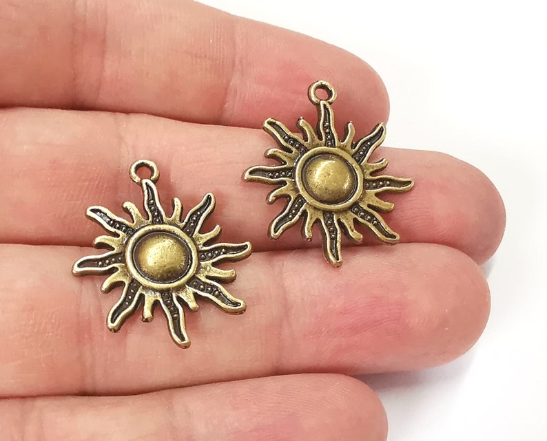 10 Sun charms Antique bronze plated charms (27x23mm) G25221