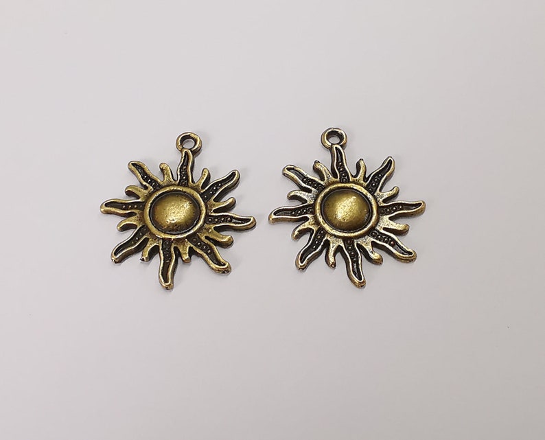 10 Sun charms Antique bronze plated charms (27x23mm) G25221
