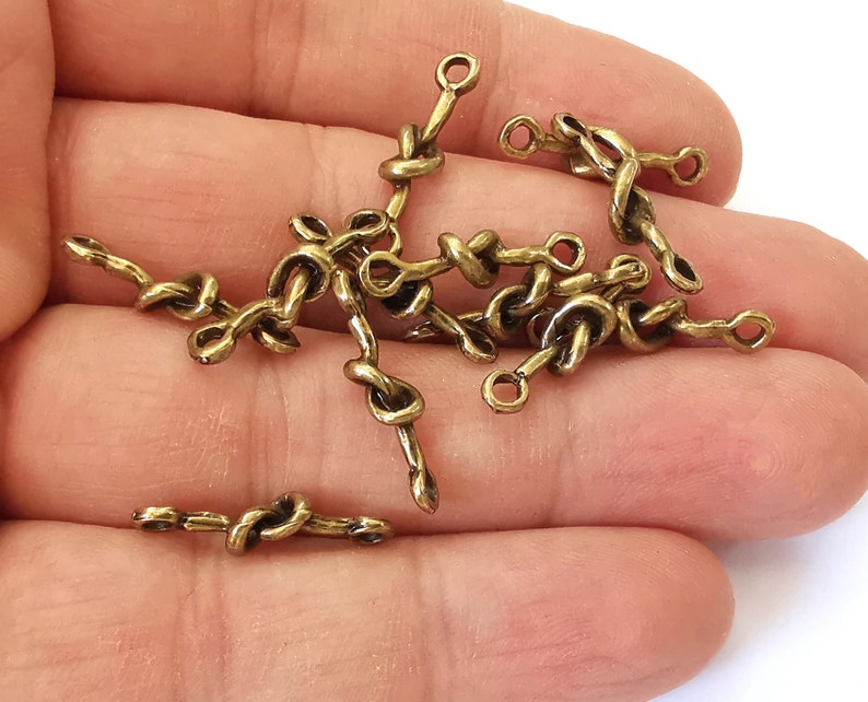 10 Knot connector charms Antique bronze plated charms (21x5mm) G25128