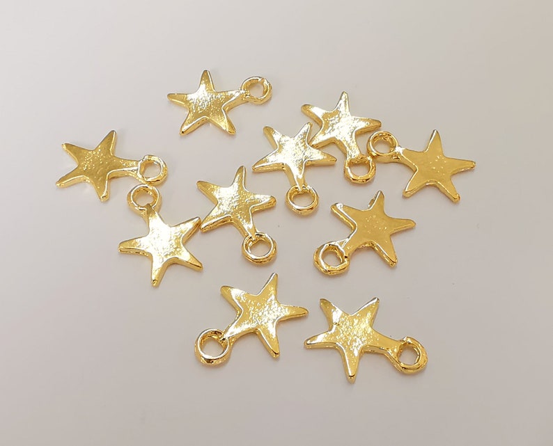 10 Star charms Shiny gold plated charms (16x12mm) G25156