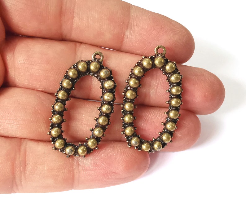 2 Antique bronze charms Antique bronze plated charms (38x22mm) G25218