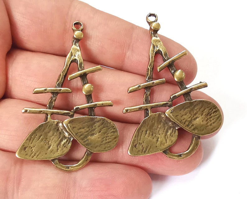 2 Antique bronze charms Antique bronze plated charms (53x34mm) G25266