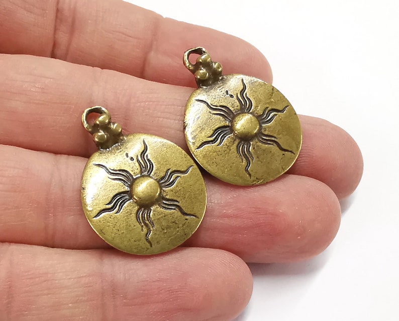 2 Sun Round Charms Antique bronze plated charms (31x23mm) G25271