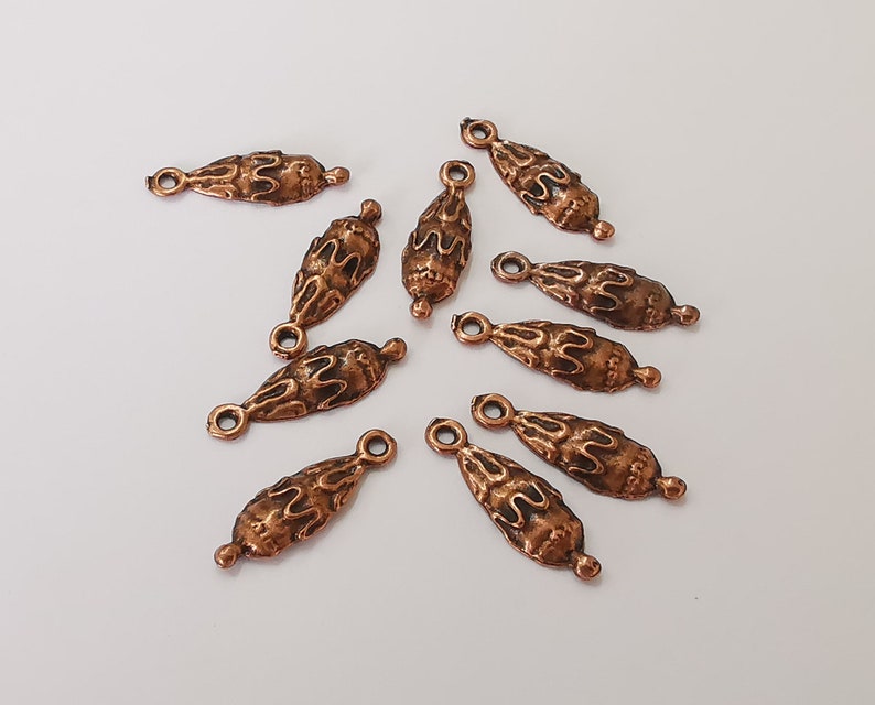 10 Antique copper charms Antique copper plated charms (22x7mm) G25566