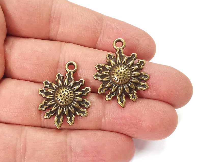4 Sun charms Antique bronze plated charms (28x21mm) G25344