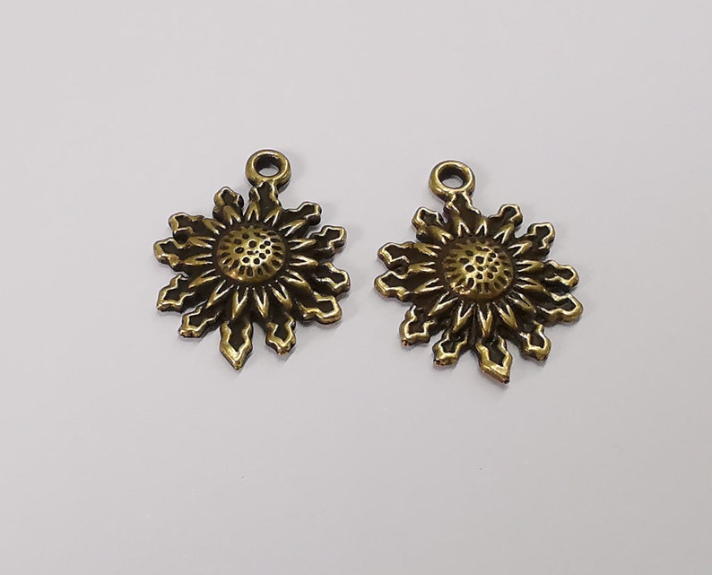 4 Sun charms Antique bronze plated charms (28x21mm) G25344