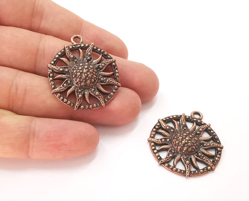 2 Sun charms Antique copper plated charms (35x31mm) G25679