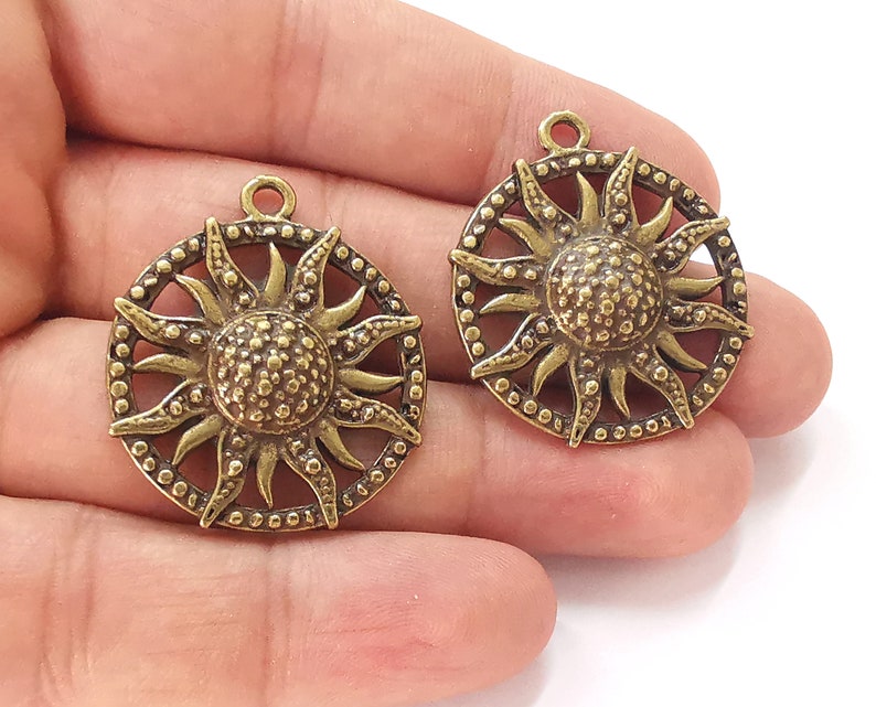 2 Sun charms Antique bronze plated charms (35x31mm) G25680