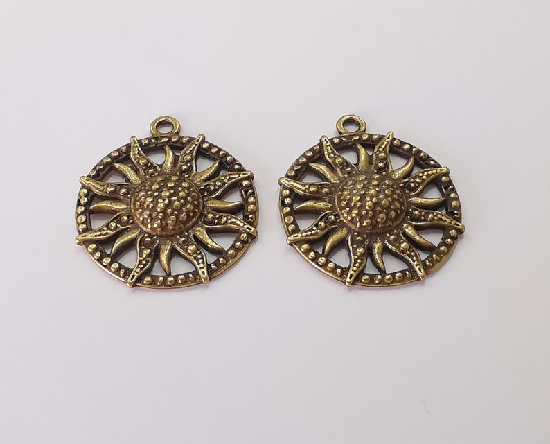 2 Sun charms Antique bronze plated charms (35x31mm) G25680