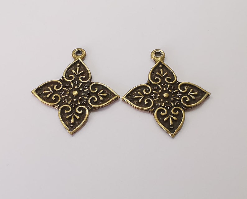 2 Antique bronze charms Antique bronze plated charms (38x33mm) G25686