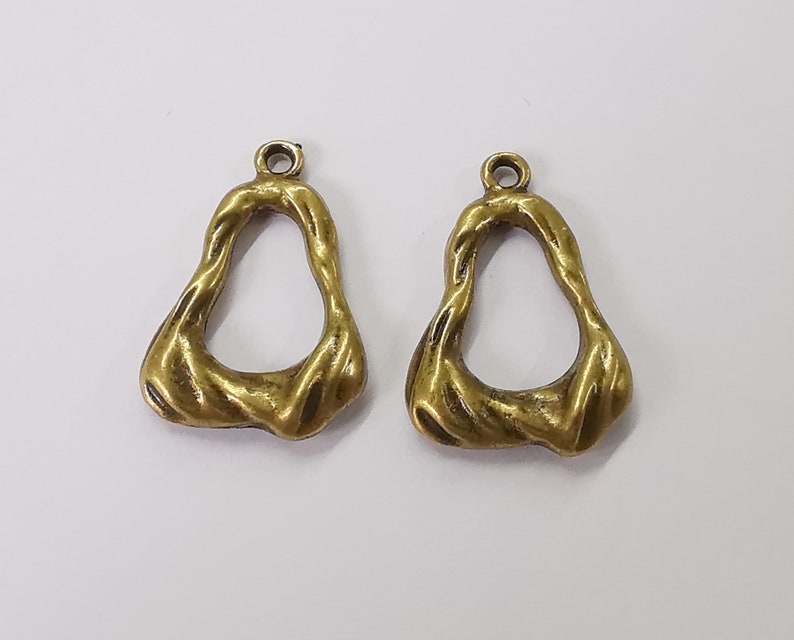 4 Antique bronze charms Antique bronze plated charms (29x19mm) G25423