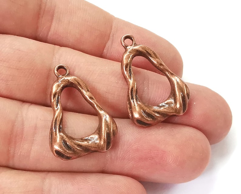 4 Antique copper charms Antique copper plated charms (29x19mm) G25430