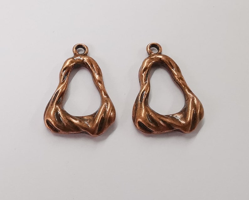 4 Antique copper charms Antique copper plated charms (29x19mm) G25430
