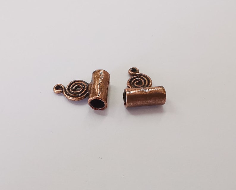 4 Swirl charms Antique copper plated brass charms (17x11mm) G25764