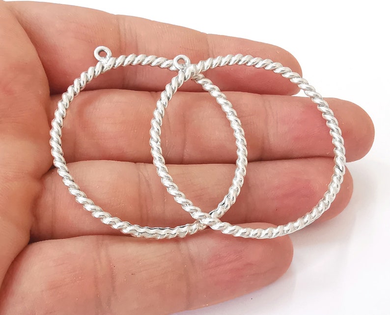 2 Twisted circle findings with loop Antique Silver Plated Circle (52x46 mm) G25621