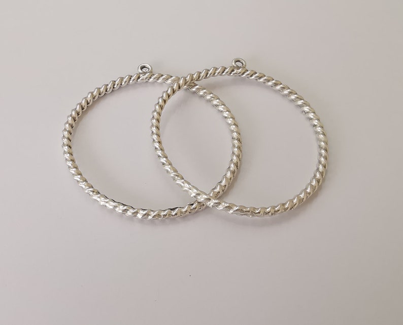 2 Twisted circle findings with loop Antique Silver Plated Circle (52x46 mm) G25621