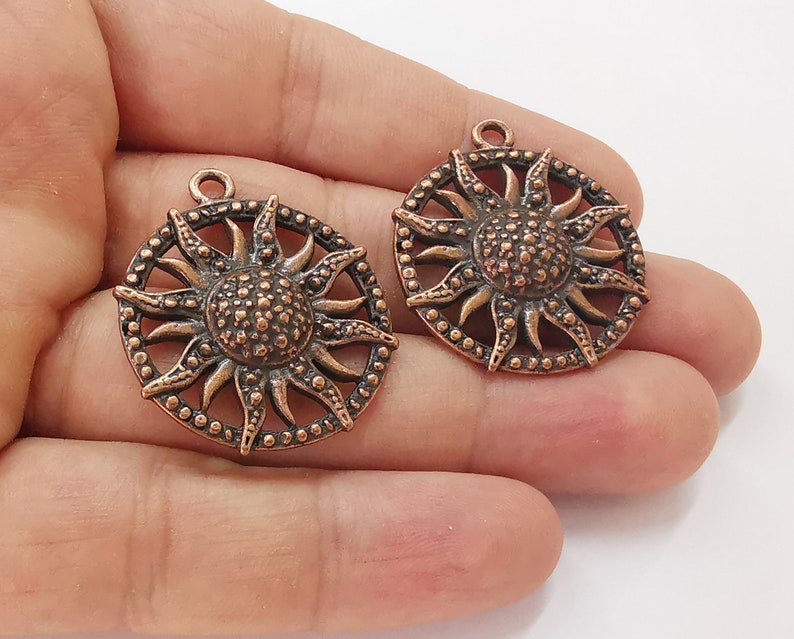 2 Sun charms Antique copper plated charms (35x31mm) G25679