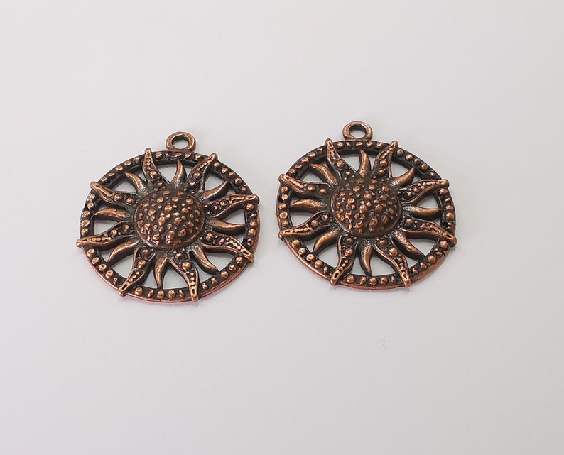 2 Sun charms Antique copper plated charms (35x31mm) G25679