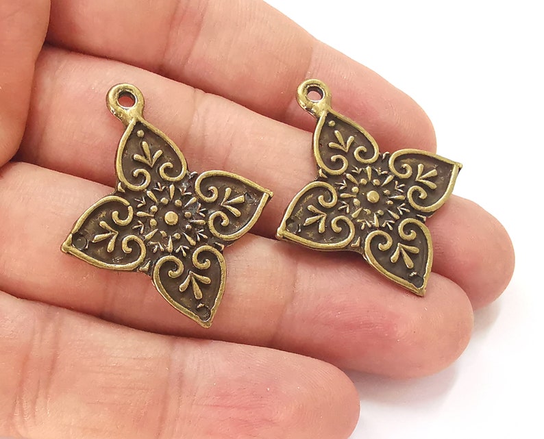 2 Antique bronze charms Antique bronze plated charms (38x33mm) G25686