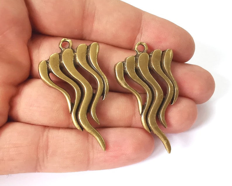 2 Antique bronze charms Antique bronze plated charms (47x26mm) G26005