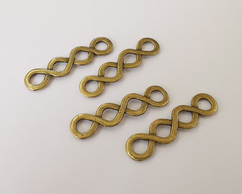 4 Twisted swirl charms connector Antique bronze plated charms (44x11mm) G26014