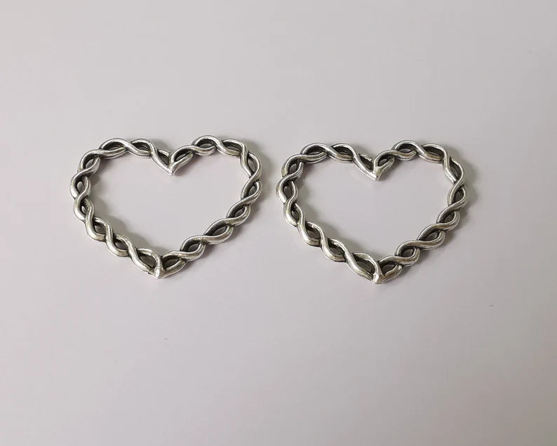 4 Twisted heart charms Antique silver plated charms (33x27mm) G26103