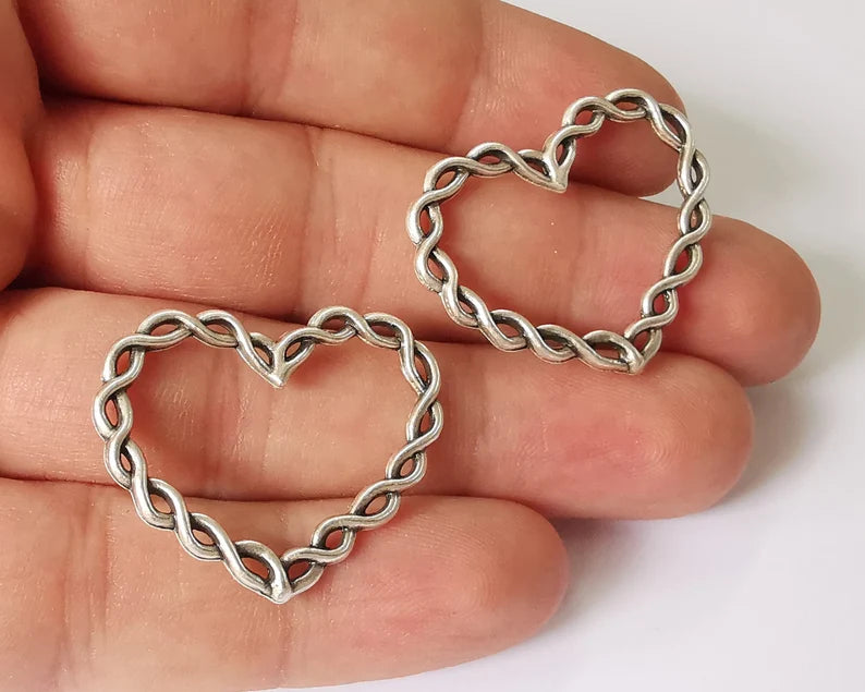 4 Twisted heart charms Antique silver plated charms (33x27mm) G26103