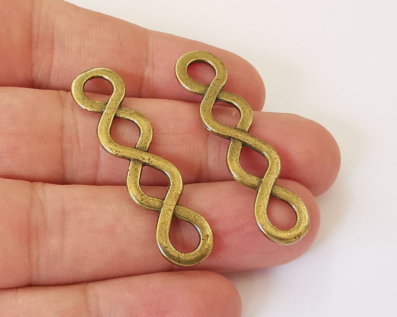 4 Twisted swirl charms connector Antique bronze plated charms (44x11mm) G26014