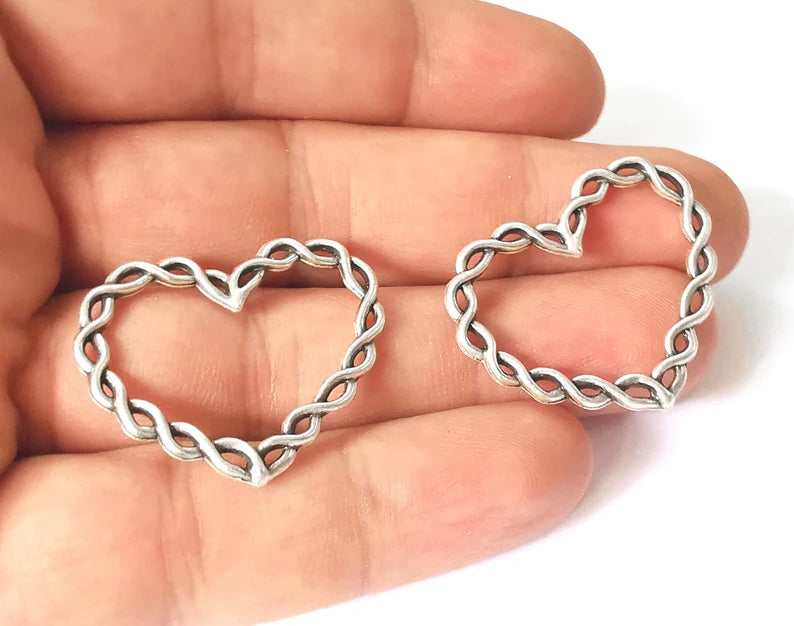 4 Twisted heart charms Antique silver plated charms (33x27mm) G26103