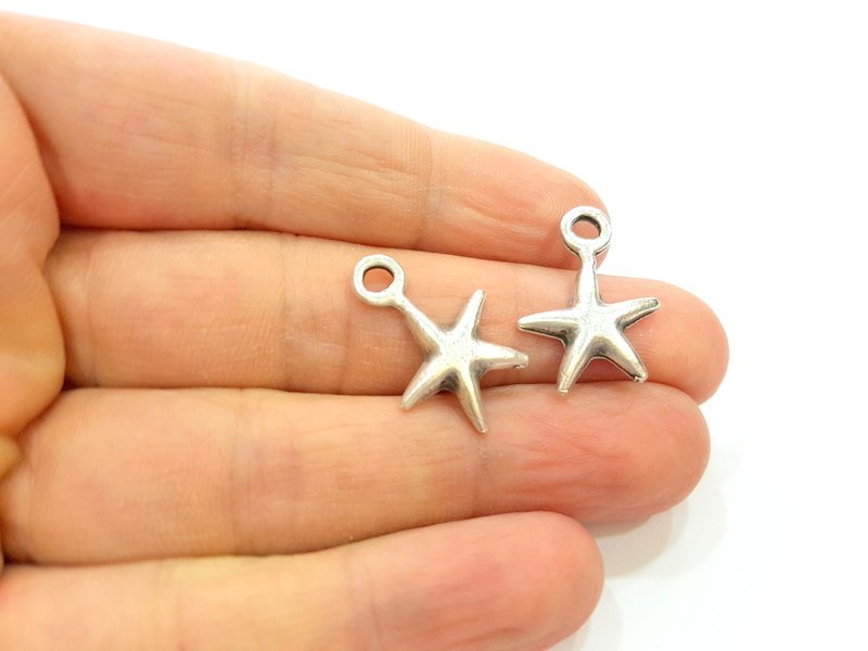 4 Silver Charms Antique Silver Plated Star Charms (23x17mm)  G14382
