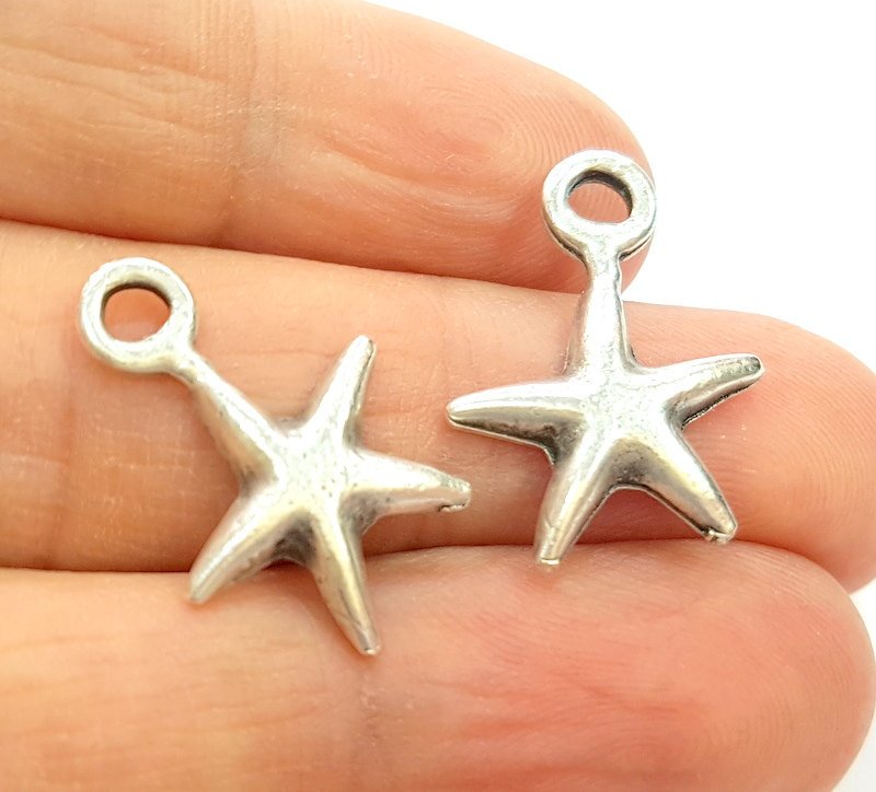 4 Silver Charms Antique Silver Plated Star Charms (23x17mm)  G14382