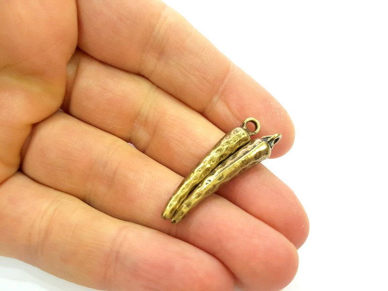 4 Antique Bronze Charms (36x6mm) G7253