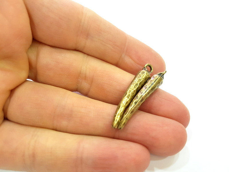 4 Antique Bronze Charms (36x6mm) G7253