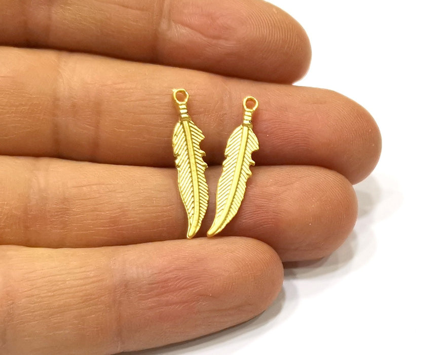 10 Feather Charms Gold Plated Charms  (25x5mm)  G16668