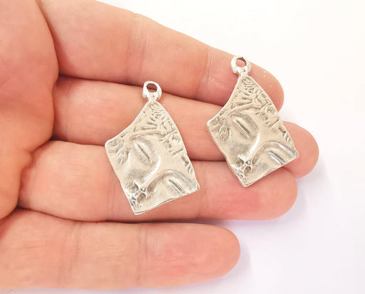 4 Antique silver face charms Silver plated charms (35x21mm)  G23491